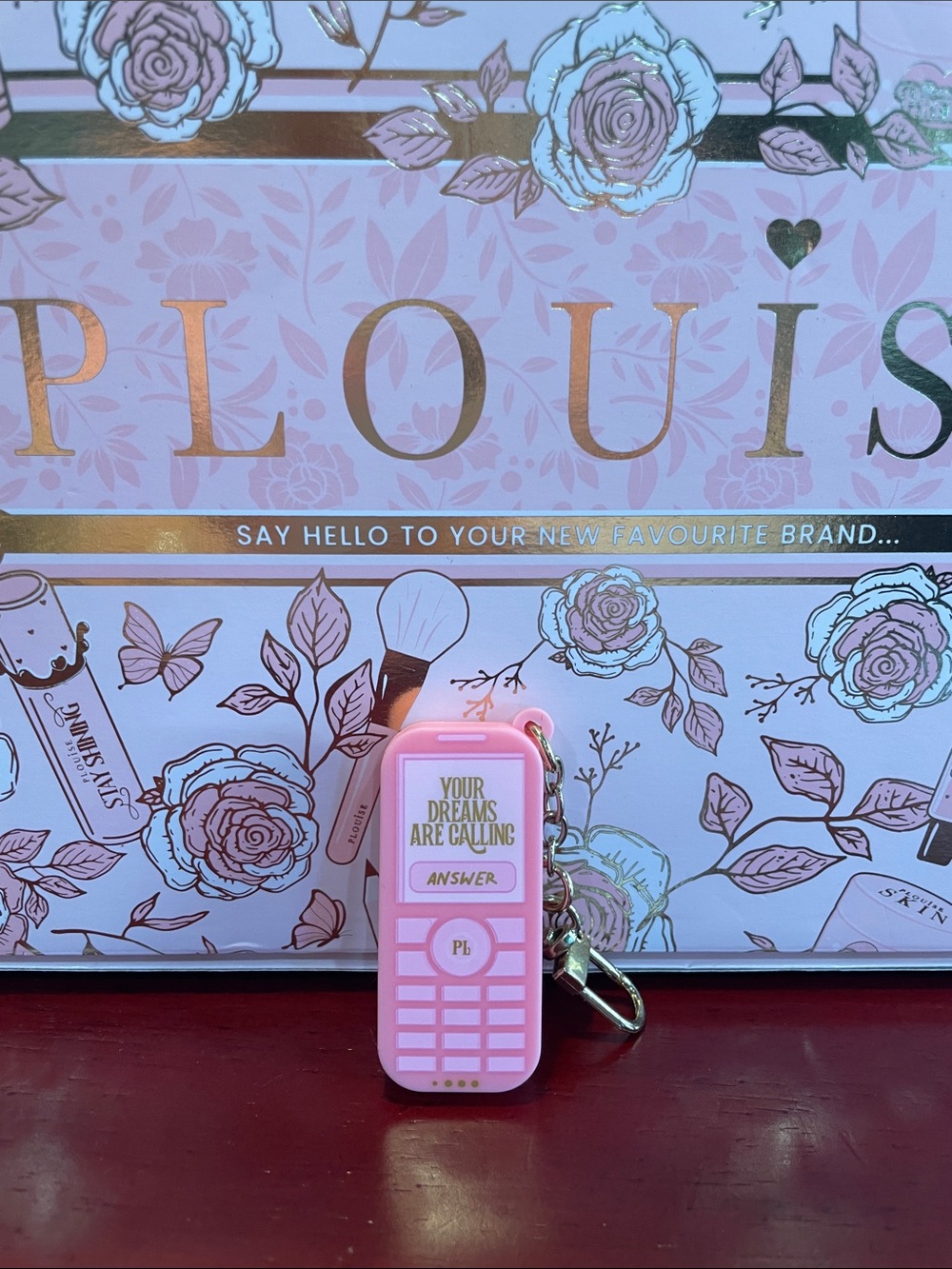 Plouise lipgloss charm. Pink Novelty Keychain cellphone- Your Dreams Are Calling